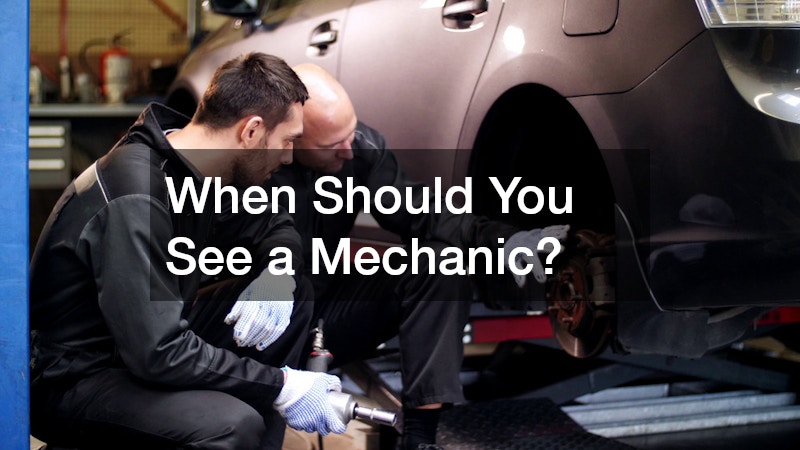 mechanics inspecting the brakes