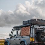 a jeep with camping tent setup